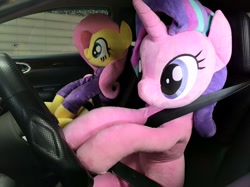 Size: 1199x899 | Tagged: safe, artist:nekokevin, character:fluttershy, character:starlight glimmer, species:pegasus, species:pony, species:unicorn, series:nekokevin's glimmy, car, clothing, cute, driving, duo, female, glimmerbetes, irl, life size, mare, photo, plushie, seatbelt, shyabetes, sitting, smiling, steering wheel, sweater, sweatershy, this will not end well