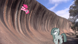 Size: 1918x1080 | Tagged: safe, artist:didgereethebrony, character:marble pie, character:pinkie pie, australia, in which pinkie pie forgets how to gravity, irl, photo, pinkie being pinkie, pinkie physics, ponies in real life, rock, wave, wave rock