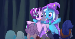 Size: 1024x537 | Tagged: safe, artist:grissaecrim, character:hoo'far, character:princess flurry heart, character:starlight glimmer, character:trixie, species:pony, species:unicorn, episode:on the road to friendship, audience, cape, clothing, crowd, female, hat, mare, open mouth, rearing, scene interpretation, smiling, stage, trixie's cape, trixie's hat, wrong eye color