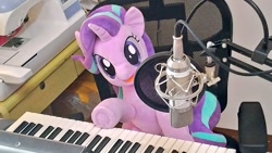 Size: 1024x577 | Tagged: safe, artist:nekokevin, character:starlight glimmer, species:pony, species:unicorn, series:nekokevin's glimmy, chair, female, irl, keyboard, looking at you, mare, microphone, musical instrument, open mouth, photo, plushie, sewing machine, sitting, smiling, solo, underhoof