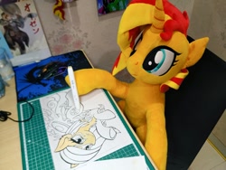Size: 1024x768 | Tagged: safe, artist:canvymamamoo, artist:nekokevin, character:sunset shimmer, oc, oc:poniko, species:pony, species:unicorn, chair, computer mouse, desk, drawing, female, irl, lineart, mare, pen, photo, plushie, raised hoof, smiling, solo, traditional art