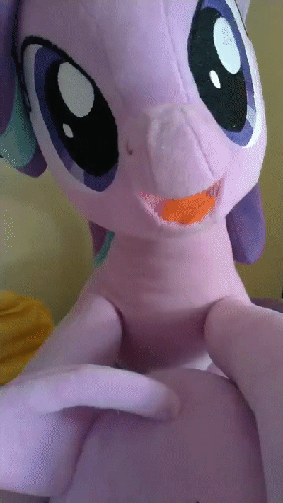 Size: 400x711 | Tagged: safe, artist:nekokevin, character:starlight glimmer, species:pony, species:unicorn, series:nekokevin's glimmy, animated, bust, cute, ear bite, female, gif, glimmerbetes, irl, looking at you, mare, nibbling, nom, open mouth, photo, plushie, ponidox, self ponidox, smiling, weapons-grade cute