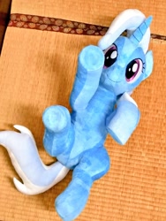 Size: 768x1024 | Tagged: safe, artist:nekokevin, character:trixie, species:pony, species:unicorn, cute, diatrixes, female, irl, looking at you, lying down, mare, on back, photo, plushie, raised hoof, smiling, solo, underhoof