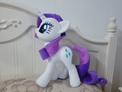 Size: 960x720 | Tagged: safe, artist:nekokevin, character:rarity, species:pony, species:unicorn, bed, female, irl, mare, photo, pillow, plushie, smiling, solo