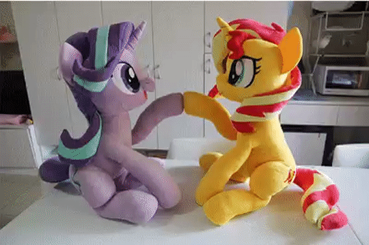 Size: 540x359 | Tagged: safe, artist:nekokevin, character:starlight glimmer, character:sunset shimmer, species:pony, species:unicorn, series:nekokevin's glimmy, animated, cute, duo, female, gif, glimmerbetes, hoofbump, irl, looking at each other, mare, open mouth, playing, plushie, raised hoof, shimmerbetes, sitting, smiling, stop motion