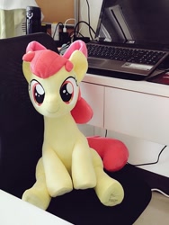 Size: 768x1024 | Tagged: safe, artist:nekokevin, character:apple bloom, species:earth pony, species:pony, adorabloom, bow, chair, computer, cute, female, filly, hair bow, irl, laptop computer, looking at you, photo, plushie, sitting, smiling, solo, table, underhoof