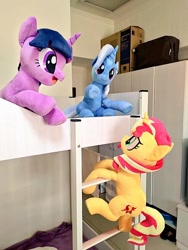 Size: 768x1024 | Tagged: safe, artist:nekokevin, character:sunset shimmer, character:trixie, character:twilight sparkle, character:twilight sparkle (unicorn), species:pony, species:unicorn, bed, climbing, female, irl, looking up, magical trio, mare, open mouth, photo, plushie, raised hoof, sitting, smiling, stairs, trio, underhoof