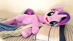 Size: 1024x576 | Tagged: safe, artist:nekokevin, character:starlight glimmer, species:pony, species:unicorn, series:nekokevin's glimmy, :d, bed, bedsheets, cute, female, glimmerbetes, happy, irl, looking at you, lying down, mare, open mouth, photo, pillow, plushie, smiling, solo
