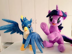 Size: 1024x768 | Tagged: safe, artist:nekokevin, character:gallus, character:twilight sparkle, character:twilight sparkle (unicorn), species:griffon, species:pony, species:unicorn, cute, duo, female, irl, looking at you, male, mare, open mouth, photo, plushie, raised hoof, sitting, smiling, spread wings, teenager, twiabetes, underhoof, wings
