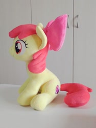 Size: 768x1024 | Tagged: safe, artist:nekokevin, character:apple bloom, species:earth pony, species:pony, bow, female, filly, hair bow, irl, photo, plushie, side view, sitting, smiling, solo
