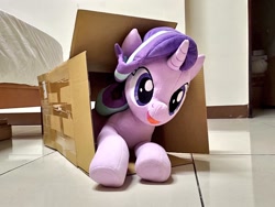 Size: 1024x768 | Tagged: safe, artist:nekokevin, character:starlight glimmer, species:pony, species:unicorn, series:nekokevin's glimmy, box, female, irl, lying down, mare, open mouth, photo, plushie, pony in a box, smiling, solo, underhoof