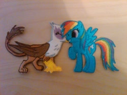 Size: 1024x768 | Tagged: safe, artist:ethepony, character:gilda, character:rainbow dash, species:griffon, ship:gildash, embroidery, female, interspecies, lesbian, photo, shipping