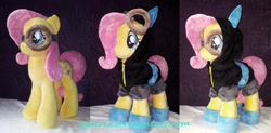 Size: 1280x630 | Tagged: safe, artist:agatrix, character:fluttershy, species:pegasus, species:pony, accessories, bunny ears, clothing, costume, dangerous mission outfit, female, goggles, hoodie, irl, mare, photo, plushie, solo
