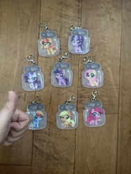 Size: 2448x3264 | Tagged: safe, artist:techycutie, character:applejack, character:fluttershy, character:pinkie pie, character:rainbow dash, character:rarity, character:starlight glimmer, character:sunset shimmer, character:twilight sparkle, character:twilight sparkle (alicorn), species:alicorn, species:pegasus, species:pony, species:unicorn, cute, female, grin, irl, jar, keychain, merchandise, open mouth, photo, pony in a bottle, smiling, thumbs up