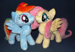 Size: 1280x893 | Tagged: safe, artist:peruserofpieces, character:fluttershy, character:rainbow dash, species:pegasus, species:pony, duo, facing each other, female, implied flutterdash, implied lesbian, implied shipping, irl, long tail, mare, photo, plushie, profile, smiling, spread wings, standing, wings