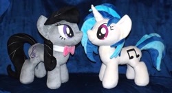 Size: 1280x695 | Tagged: safe, artist:peruserofpieces, character:dj pon-3, character:octavia melody, character:vinyl scratch, species:earth pony, species:pony, species:unicorn, bow, bow tie, duo, facing each other, female, implied lesbian, implied scratchtavia, implied shipping, irl, mare, necktie, photo, plushie, profile, smiling, toy