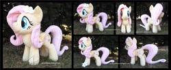 Size: 4275x1754 | Tagged: safe, artist:peruserofpieces, character:fluttershy, species:pegasus, species:pony, accessory, female, flower, flower in hair, folded wings, front view, happy, irl, long tail, mare, photo, plushie, profile, smiling, solo, toy, wings