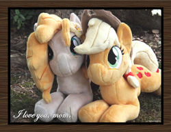 Size: 1650x1275 | Tagged: safe, artist:peruserofpieces, character:applejack, character:pear butter, species:earth pony, species:pony, beanie (plushie), female, irl, looking at you, mare, mother and child, mother and daughter, photo, plushie, prone