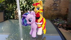 Size: 3264x1836 | Tagged: safe, artist:ketika, character:starlight glimmer, character:sunset shimmer, species:anthro, species:pony, species:unicorn, anthro plushie, anthro with ponies, anthros riding ponies, aurora, clothing, female, irl, mare, photo, plushie, posable, riding, santa costume, socks, stockings, sunset santa