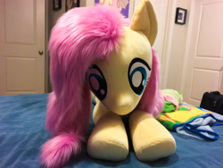 Size: 4032x3024 | Tagged: safe, artist:natureshy, artist:qtpony, character:fluttershy, species:pony, female, fluffy, front view, irl, life size, lying on bed, photo, plushie, prone