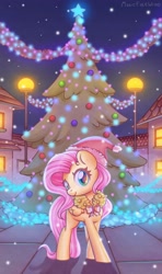 Size: 1600x2702 | Tagged: safe, artist:wavecipher, character:fluttershy, species:pegasus, species:pony, christmas, christmas tree, christmas wreath, clothing, cute, female, folded wings, hat, head turn, holiday, looking at you, mare, night, outdoors, santa hat, shyabetes, smiling, solo, standing, tree, wings, wreath