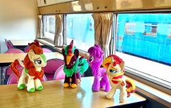 Size: 2082x1314 | Tagged: safe, artist:hihin1993, character:autumn blaze, character:berry punch, character:berryshine, character:cinder glow, character:summer flare, character:sunset shimmer, species:kirin, irl, japan, photo, plushie, train
