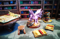 Size: 1200x785 | Tagged: safe, artist:velgarn, derpibooru original, character:twilight sparkle, character:twilight sparkle (alicorn), species:alicorn, species:pony, book, bookhorse, bookshelf, excited, female, figurine, gaming miniature, library, map, miniature, pewter ponies, photo, pile of books, scenery, solo, stool, table