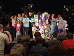 Size: 1024x768 | Tagged: safe, artist:whiteheather, species:human, 2014, auction, cathy weseluck, charity, convention, everfree northwest, irl, irl human, marÿke hendrikse, photo, quilt, stage