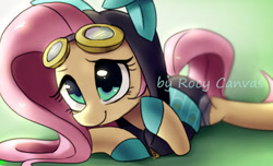 Size: 1039x630 | Tagged: safe, artist:rocy canvas, character:fluttershy, species:pegasus, species:pony, bunny ears, clothing, costume, cute, dangerous mission outfit, female, goggles, green background, hoodie, looking at you, mare, pixiv, prone, shyabetes, simple background, smiling, solo, watermark