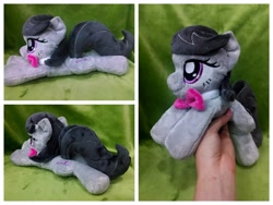 Size: 1600x1200 | Tagged: safe, artist:equinepalette, character:octavia melody, species:earth pony, species:pony, beanie (plushie), bow tie, female, hand, irl, mare, photo, plushie, prone, solo
