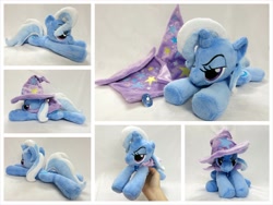 Size: 1024x768 | Tagged: safe, artist:equinepalette, character:trixie, species:pony, species:unicorn, beanie (plushie), cape, clothing, female, hand, hat, irl, mare, photo, plushie, prone, solo, trixie's cape, trixie's hat
