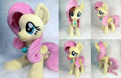Size: 1280x825 | Tagged: safe, artist:doctorkoda, character:fluttershy, species:pony, deviantart watermark, female, filly, filly fluttershy, irl, obtrusive watermark, photo, plushie, solo, watermark, younger