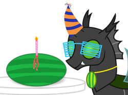 Size: 1067x800 | Tagged: safe, artist:toyminator900, derpibooru original, oc, oc only, oc:éling chang, species:changeling, candle, changeling loves watermelon, changeling oc, clothing, food, glasses, green changeling, hat, medallion, party hat, simple background, smiling, solo, transparent background, watermelon
