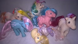 Size: 3190x1840 | Tagged: safe, artist:edhelistar, derpibooru original, character:bowtie (g1), character:firefly, character:moondancer (g1), species:earth pony, species:pegasus, species:pony, species:sea pony, species:unicorn, g1, baby, baby pony, baby sea pony, bouquet (g1), irl, photo, starshine, sun shower, toy, yo-yo (g1)