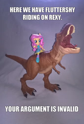 Size: 1833x2683 | Tagged: safe, artist:edhelistar, derpibooru original, character:fluttershy, my little pony:equestria girls, badass, crossover, dinosaur, doll, equestria girls minis, fall formal outfits, flutterbadass, humans riding dinosaurs, image macro, irl, jurassic park, jurassic world, knee-high boots, meme, photo, ponied up, rexy, riding, roar, text, toy, tyrannosaurus rex, your argument is invalid