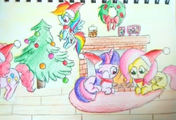Size: 2527x1731 | Tagged: safe, artist:sumi-mlp25, character:fluttershy, character:pinkie pie, character:rainbow dash, character:twilight sparkle, species:pony, christmas, christmas tree, clothing, cookie, fireplace, food, hat, holiday, one eye closed, photos, rug, santa hat, scarf, traditional art, tree, wink, wooden floor, wreath