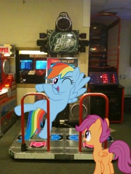 Size: 1536x2048 | Tagged: safe, artist:dreamcasterpegasus, artist:proenix, artist:tamalesyatole, character:rainbow dash, character:scootaloo, species:pegasus, species:pony, arcade, dance dance revolution, irl, photo, plot, ponies in real life, rhythm game, vector, wink