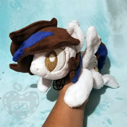 Size: 1000x1000 | Tagged: safe, artist:appledew, oc, oc only, oc:rose bell, species:pegasus, species:pony, beanie (plushie), female, hand, irl, jewelry, mare, necklace, photo, plushie, prone, solo, wings