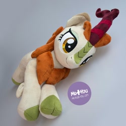 Size: 1600x1600 | Tagged: safe, alternate version, artist:meplushyou, character:autumn blaze, species:kirin, episode:sounds of silence, g4, my little pony: friendship is magic, cloven hooves, female, irl, photo, plushie, prone, smiling, solo, watermark