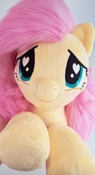 Size: 1080x1992 | Tagged: safe, artist:meplushyou, character:fluttershy, species:pegasus, species:pony, blushing, cute, heart eyes, hnnng, irl, photo, plushie, shyabetes, smiling, solo, weapons-grade cute, wingding eyes