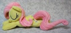 Size: 3158x1492 | Tagged: safe, artist:bluedragonflyplush, character:fluttershy, species:pegasus, species:pony, beanie (plushie), eyes closed, folded wings, irl, photo, plushie, prone, sleeping, solo, wings