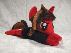 Size: 1032x774 | Tagged: safe, artist:bluedragonflyplush, species:pony, species:unicorn, all time low, beanie (plushie), clothing, commission, horn, irl, jack barakat, male, photo, plushie, ponified, prone, shirt, smiling, smirk, solo, stallion, t-shirt