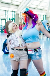 Size: 712x1072 | Tagged: safe, artist:agentt3xas, artist:geekeryandsuch, character:applejack, character:rainbow dash, species:human, anime expo, belly button, cosplay, irl, irl human, midriff, muffin top, photo