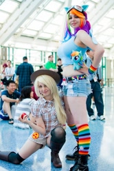 Size: 712x1072 | Tagged: safe, artist:agentt3xas, artist:geekeryandsuch, character:applejack, character:rainbow dash, species:human, anime expo, belly button, cosplay, irl, irl human, midriff, photo