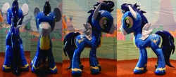 Size: 1280x562 | Tagged: safe, artist:plushypuppy, character:soarin', species:pegasus, species:pony, clothing, irl, male, photo, plushie, shiny, solo, spread wings, stallion, standing, uniform, wings, wonderbolts uniform
