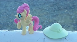 Size: 4096x2241 | Tagged: safe, artist:dingopatagonico, character:fluttershy, species:pony, clothing, hat, irl, photo, solo, toy