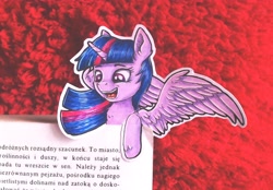 Size: 3705x2577 | Tagged: safe, artist:rysunkowasucharia, character:twilight sparkle, character:twilight sparkle (alicorn), species:alicorn, species:pony, book, bookmark, colored pencil drawing, cute, cutout, female, high res, irl, mare, photo, polish, pony bookmark, solo, spread wings, text, that pony sure does love books, the plague (novel), traditional art, twiabetes, wings