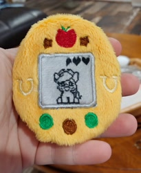 Size: 1683x2048 | Tagged: safe, artist:sew_adorkable, artist:trashkitten-plushies, character:applejack, buttons, embroidery, irl, photo, plushie, solo, tamagotchi