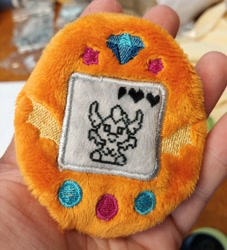 Size: 1862x2048 | Tagged: safe, artist:sew_adorkable, character:smolder, species:dragon, g4, craft, cute, embroidery, female, hand, irl, photo, plushie, smolderbetes, tamagotchi