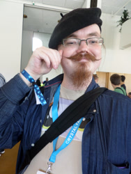 Size: 3456x4608 | Tagged: safe, artist:juu50x, species:human, 2014, barely pony related, clothing, crystal fair con, evil, finland, finlandia hall, glasses, hat, helsinki, irl, irl human, moustache, photo, swang, the stache